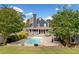 Backyard with an in-ground pool, patio, and well-manicured landscaping at 2545 Hickory Level Rd, Villa Rica, GA 30180