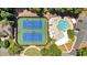 Overhead view of tennis courts and pool area with lounge seating at 3400 Dencrest Se Ct, Smyrna, GA 30080