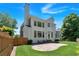 Spacious backyard featuring a well-maintained lawn and a large back porch at 3400 Dencrest Se Ct, Smyrna, GA 30080
