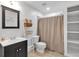 Cozy bathroom featuring a vanity with dark cabinets, ladder with towels, and shower with curtain at 3400 Dencrest Se Ct, Smyrna, GA 30080