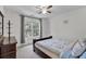 Cozy bedroom with natural light, a ceiling fan, and a comfortable bed at 3400 Dencrest Se Ct, Smyrna, GA 30080