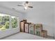 Bright bedroom with a ceiling fan, lots of natural light and move-in boxes at 3400 Dencrest Se Ct, Smyrna, GA 30080