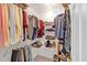 Walk-in closet with rod and shelves for optimal clothing storage and organization at 3400 Dencrest Se Ct, Smyrna, GA 30080