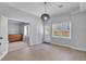 Dining Room with wood floors, natural light, and a view into a second room with bureau at 3400 Dencrest Se Ct, Smyrna, GA 30080