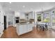 Modern eat-in kitchen with an island, granite countertops, and stainless steel appliances at 3400 Dencrest Se Ct, Smyrna, GA 30080