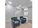 Neutral-toned living room featuring recessed lighting, light gray walls and two blue chairs at 3400 Dencrest Se Ct, Smyrna, GA 30080