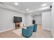 Finished basement showcasing recessed lighting, light gray walls and two blue chairs at 3400 Dencrest Se Ct, Smyrna, GA 30080