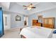 Bright main bedroom features a tray ceiling, natural light, and neutral colored walls at 3400 Dencrest Se Ct, Smyrna, GA 30080