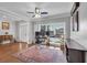Bright home office with large windows, hardwood floors, and a ceiling fan at 3400 Dencrest Se Ct, Smyrna, GA 30080