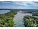 Aerial View of waterfront property with lush shoreline and community docks at 5345 Pilgrim Point Rd, Cumming, GA 30041