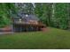 Expansive backyard showcasing a large deck, providing ample space for outdoor enjoyment at 5345 Pilgrim Point Rd, Cumming, GA 30041