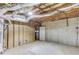 Unfinished basement with exposed ductwork, concrete walls, and a doorway to another area at 5345 Pilgrim Point Rd, Cumming, GA 30041