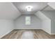 A bright bedroom offers neutral paint and modern laminate flooring at 5345 Pilgrim Point Rd, Cumming, GA 30041