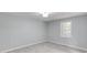 Light-filled bedroom with gray walls, modern ceiling fan and luxury vinyl plank flooring at 5345 Pilgrim Point Rd, Cumming, GA 30041