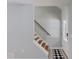 Well-lit foyer featuring hardwood stairs and light gray walls at 5345 Pilgrim Point Rd, Cumming, GA 30041