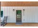 View of front door with dark wood door, black hardware, and address at 5345 Pilgrim Point Rd, Cumming, GA 30041