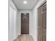A well-lit hallway features contemporary paint, and door designs at 5345 Pilgrim Point Rd, Cumming, GA 30041