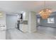 Well-lit kitchen with white cabinets, modern appliances, and hardwood flooring at 5345 Pilgrim Point Rd, Cumming, GA 30041