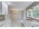 Well-lit kitchen featuring granite countertops, decorative backsplash, stainless steel sink, and a breakfast nook at 5345 Pilgrim Point Rd, Cumming, GA 30041