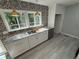 Modern kitchen featuring granite countertops, stainless steel appliances, and elegant backsplash at 5345 Pilgrim Point Rd, Cumming, GA 30041