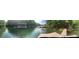 Lake view of boat docks on the water and trees in the background at 5345 Pilgrim Point Rd, Cumming, GA 30041