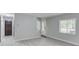 Bright living room with hardwood floors, white trim, and stylish gray walls at 5345 Pilgrim Point Rd, Cumming, GA 30041