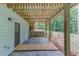 Covered patio area provides shade and access to the backyard, enhancing outdoor living at 5345 Pilgrim Point Rd, Cumming, GA 30041