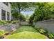 Professionally landscaped backyard with lush lawn and privacy fence at 1748 N Pelham Ne Rd, Atlanta, GA 30324