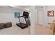 Bright finished basement includes exercise equipment and decor, perfect for a home gym at 1748 N Pelham Ne Rd, Atlanta, GA 30324