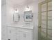 Bathroom featuring a double vanity with white marble countertops and modern fixtures at 1748 N Pelham Ne Rd, Atlanta, GA 30324