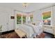 Bedroom boasts natural light, hardwood floors, and a neutral color palette at 1748 N Pelham Ne Rd, Atlanta, GA 30324
