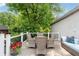 Relaxing deck with a table and chairs offers an ideal spot for enjoying the surrounding greenery at 1748 N Pelham Ne Rd, Atlanta, GA 30324