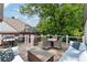 Inviting deck area features comfortable seating and a grill, perfect for outdoor entertaining at 1748 N Pelham Ne Rd, Atlanta, GA 30324
