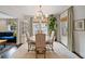 Elegant dining room featuring a chandelier, dining table, and view to a seating area at 1748 N Pelham Ne Rd, Atlanta, GA 30324
