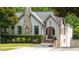 Beautiful home exterior with stone chimney and brick-lined archway at 1748 N Pelham Ne Rd, Atlanta, GA 30324