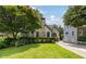 Charming home with manicured front lawn and mature trees at 1748 N Pelham Ne Rd, Atlanta, GA 30324