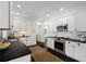 Modern kitchen featuring white cabinets, sleek countertops, and stainless steel appliances at 1748 N Pelham Ne Rd, Atlanta, GA 30324