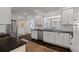 Well-appointed kitchen with stainless steel appliances, a sink, and a view into the dining room at 1748 N Pelham Ne Rd, Atlanta, GA 30324