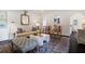 Comfortable living room featuring classic furniture, a decorative mirror, and hardwood floors at 1748 N Pelham Ne Rd, Atlanta, GA 30324