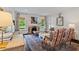 Bright living room featuring a fireplace, hardwood floors, and stylish seating arrangements at 1748 N Pelham Ne Rd, Atlanta, GA 30324