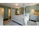 Inviting bedroom with a four-poster bed, soft colors, and views of the outdoors at 1748 N Pelham Ne Rd, Atlanta, GA 30324