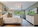 Serene bedroom showcasing a four-poster bed, natural light, and a calming color scheme at 1748 N Pelham Ne Rd, Atlanta, GA 30324
