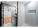 Modern bathroom features a wood vanity top, vessel sink, and frameless glass walk-in shower with marble tiling at 1924 Variations Ne Dr, Atlanta, GA 30329