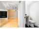 View of a half-bathroom with wood vanity and black flooring adjacent to a living room at 1924 Variations Ne Dr, Atlanta, GA 30329