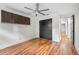 Bedroom with dark wood storage, hardwood floors, and neutral walls at 1924 Variations Ne Dr, Atlanta, GA 30329
