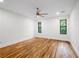 Spacious bedroom with hardwood floors, large windows, and neutral paint at 1924 Variations Ne Dr, Atlanta, GA 30329