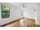 Bright bedroom offers hardwood floors, ample natural light from windows, and neutral wall color at 1924 Variations Ne Dr, Atlanta, GA 30329