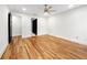 Bright bedroom with hardwood floors, ceiling fan, and crisp white walls at 1924 Variations Ne Dr, Atlanta, GA 30329