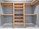 Custom closet featuring shelving with hanging rods that provides efficient storage solutions at 1924 Variations Ne Dr, Atlanta, GA 30329