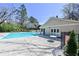 Relaxing community pool area with stamped concrete, ample seating, and a sun-drenched deck at 1924 Variations Ne Dr, Atlanta, GA 30329